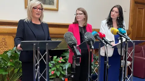 PA Michelle O'Neill, Caoimhe Archibald and Emma Little-Pengelly were speaking at a press conference at Stormont Castle