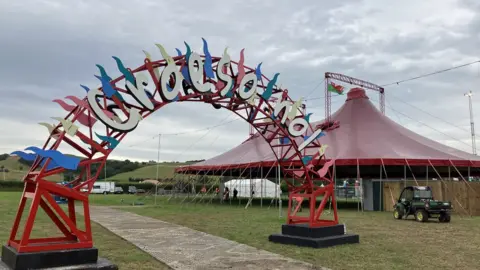 Metal arch with welcome back in welsh language