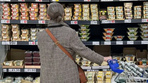 Getty Images Woman shopping in Tesco