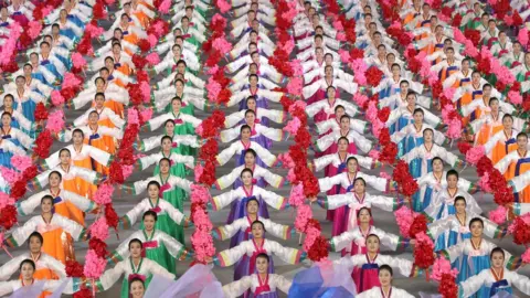 AFP In a photo taken on September 19, 2018 performers dance during a "mass games" gymnastic and artistic performance