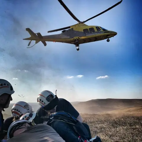 Edale Mountain Rescue Team The air ambulance lands at the site