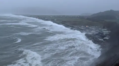 Waves crash on to the shore at Fairbourne, Gwynedd, on Sunday morning