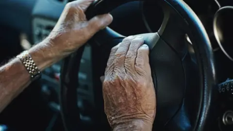 Getty Images Older person driving