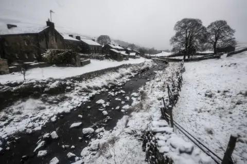 PA Snowy conditions near Thwaite in North Yorkshire