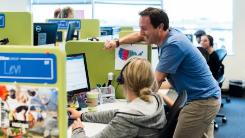 Zillow Spencer chatting to employees