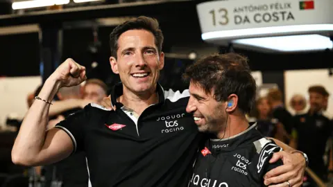 Sam Bagnall/LAT Images Ian James (right) hugs driver Antonio Felix da Costa of Portugal and Jaguar TCS Racing as they celebrate winning the team championship during the London E-Prix, Round 17 of the 2026 FIA Formula E World Championship at ExCel London on 16 August.