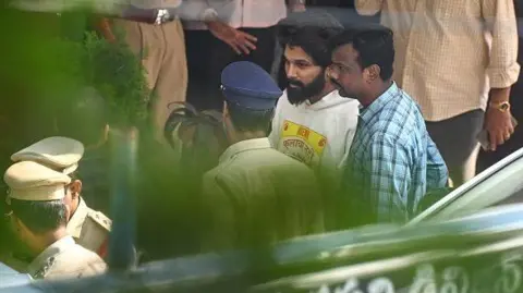 Getty Images Actor Allu Arjun comes out of the Chikkadpally police station following his arrest by the police in Hyderabad on December 13, 2024