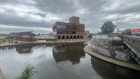 Cleaver and Wake in the Island Quarter with grey sky above