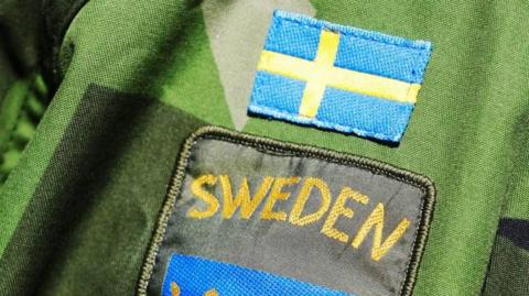 Swedish badge on uniform sleeve