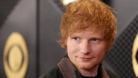 Ed Sheeran looking to his right