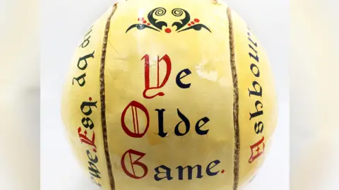 Hansons Auctioneers Royal Shrovetide ball inscribed with the words - Ye Olde Game.