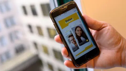 Getty Images phone showing the dating application Bumble in 2020