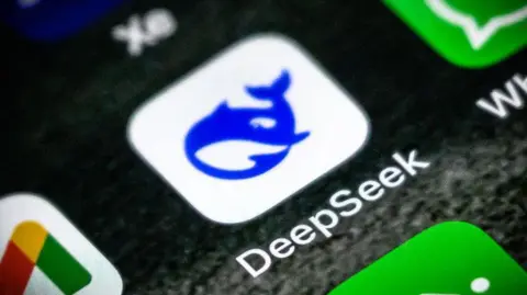 Getty Image Deepsake logo - a purple cartoon whale - an iPhone on home screen