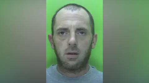 Nottinghamshire Police Mugshot of James Pedley with a green background