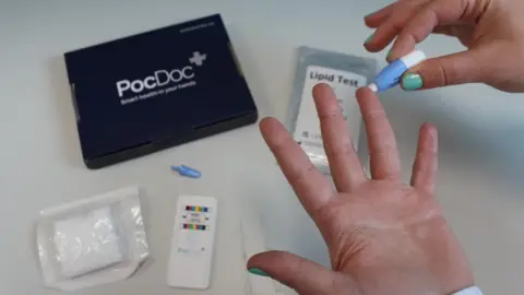 PocDoc testing kit in black case and a finger on a hand being tested