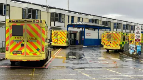 Jill Bennett/BBC A bid of ambulances extracurricular nan Queen Elizabeth Hospital successful King's Lynn emergency department.