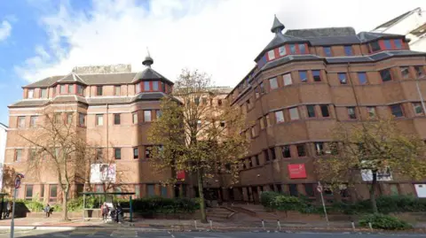 Cardiff Sixth Form College is a red brick building with trees outside