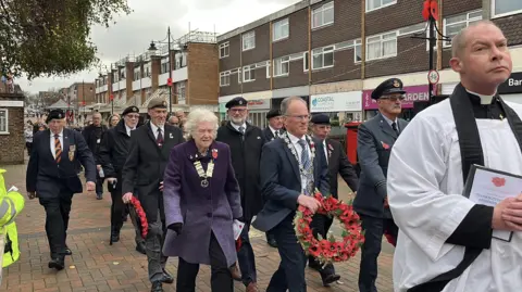 George Carden/BBC Town dignitaries and veterans marching in Burgess Hill.