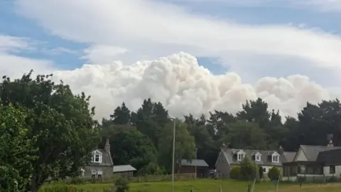 Smoke rising near the village of Nethy Bridge during the wildfire in the Cairngorms National Park.
