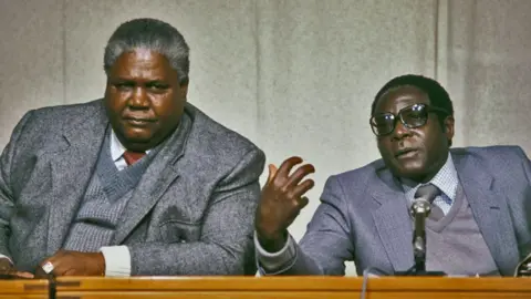 Getty Images Robert Mugabe (R) and Joshua Nkomo (L)