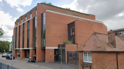 Google A general view of the six-storey hotel, with barriers leading to the River Thames passing by 