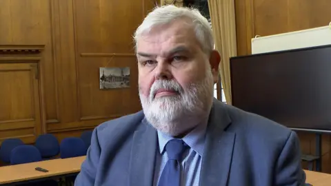 David Thomas, Leader of Torbay Council, in a room in Torquay Town Hall