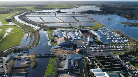 Aerial view of flooding in Potter Heigham in November 2023 shows homes and businesses surrounded by flood water. 