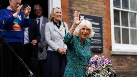 Queen Camilla waving as she leaves Lamb House