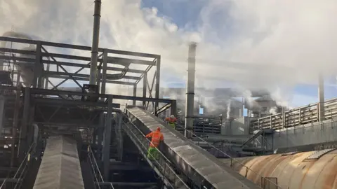 Jill Bennett/BBC Factory workers at sugar beet factory