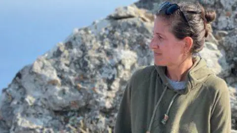 Katerina Michaelides Prof Katerina Michaelides from University of Bristol who co-authored the study standing in a green hoodie with sunglasses on her brown hair tied back in front of rocks and sea