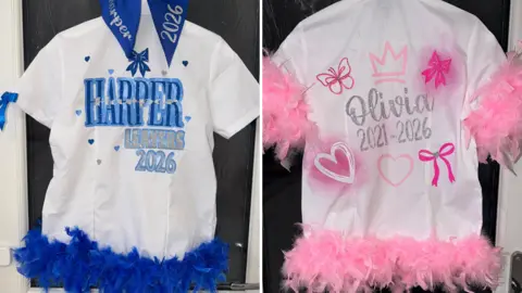 Two school shirts have coloured feathers attached to the bottom