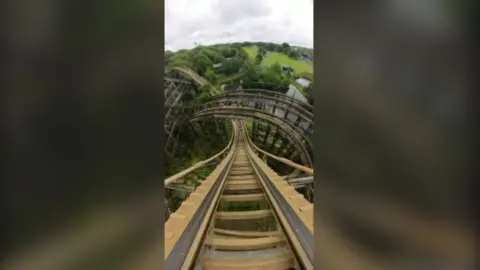 A view of a wooden rollercoaster