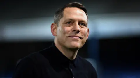 Reading boss Leam Richardson looks on from the sidelines