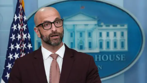 Exodus at CDC as director ousted and senior leaders resign Getty Images Demetre Daskalakis wears glasses and a suit in the White House briefing room