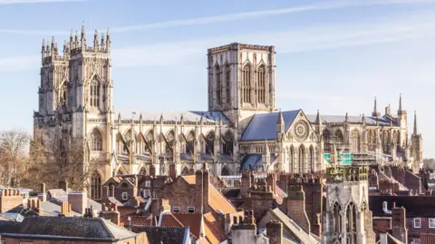 Getty Images A view of York Minster against the skyline - a large, Gothic cathedral.