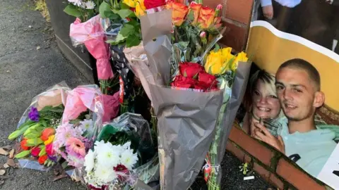 Supplied Floral tributes in Belgrave Road in Leicester where Matthew was found dead.