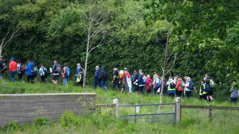 Pacemaker People walking along the towpath. 
