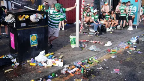 PA Media Bins were left overflowing as a result of the 2025 celebrations and a considerable amount of rubbish littered the street