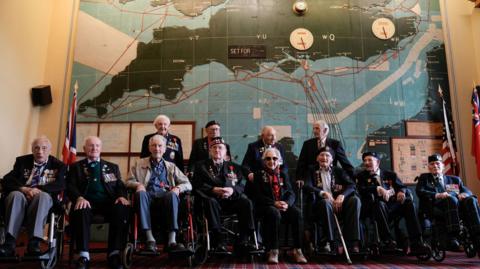 Normandy veterans pose for a photograph in the Map room at Southwick House, during an event hosted by the Spirit of Normandy Trust and D-Day Revisited at Southwick House, the nerve centre of D-Day operations 80 years ago, near Portsmouth, Hampshire