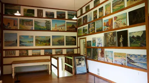 National Trust A series of paintings hanging on the wall of Chartwell. 