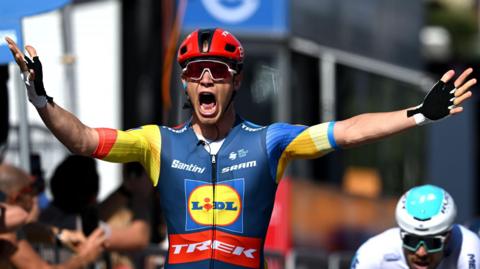 Jonathan Milan celebrates winning stage four at the Giro d'Italia