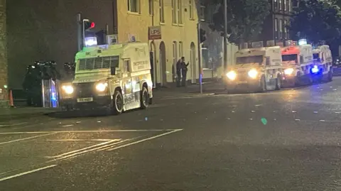 Police land rovers parked on a road in east Belfast 