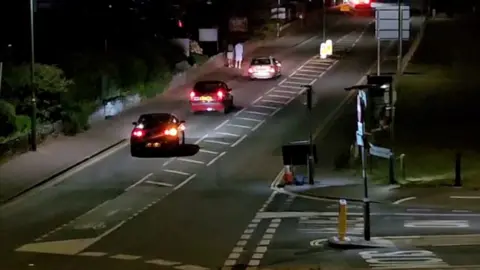 Contributed Three cars with adapted exhausts creating noise while driving along The Esplanade in Paignton in the early hours of the morning