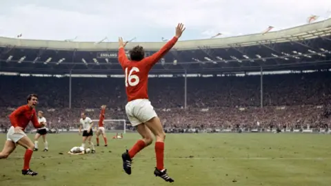 PA Martin Peters celebrates scoring England's second goal
