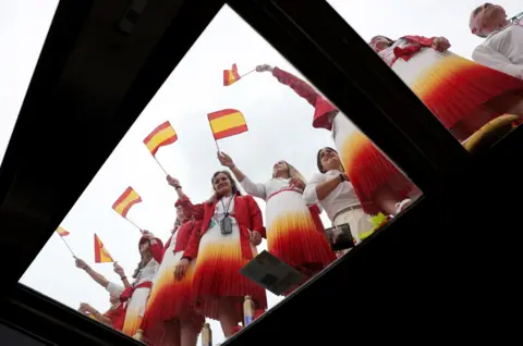   Violeta Santos Moura/Reuters Athletes from Team Spain wave Spanish flags during the opening ceremony