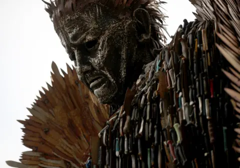 Close up of face of Knife Angel, a 27ft sculpture built using 100,000 knives collected through amnesties and confiscations