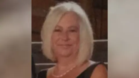 Police Scotland A woman with blonde shoulder-length hair wearing a black vest top