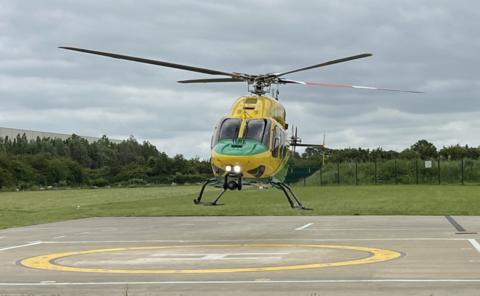 Wiltshire Air Ambulance helicopter landing on the helipad at the charity's airbase in Semington