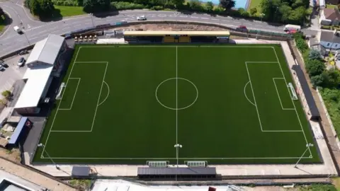 WTFC/Matthew Montague Architects An aerial CGI image of a football pitch with infrastructure 