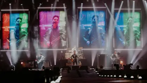 Getty Images Stereophonics perform at Principality Stadium in Cardiff in 2022 with images of Kelly Jones singing above the stage on large screens